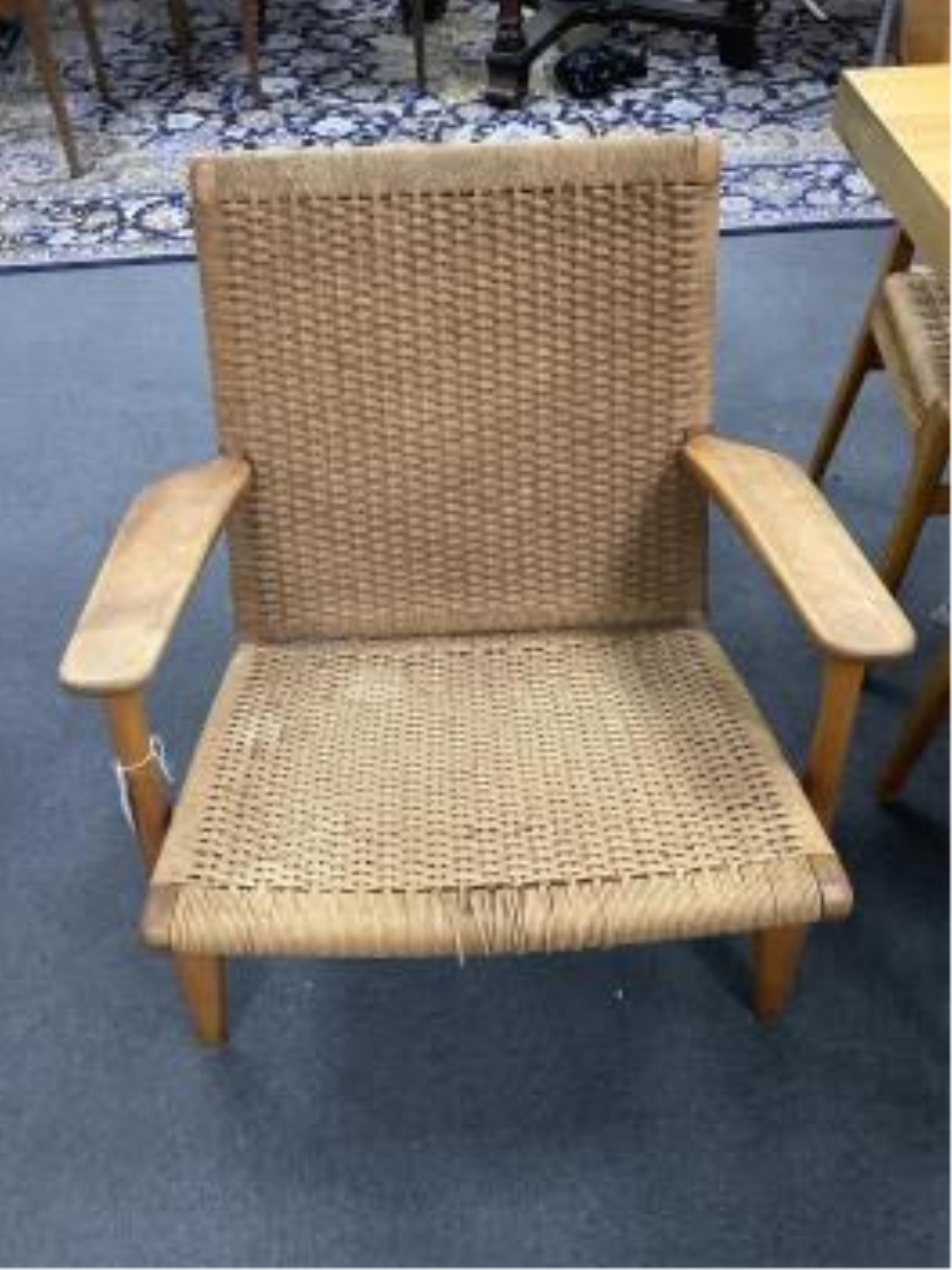 Hans J Wegner for Carl Hansen & Son, a model CH25 oak beech and paper cord lounge chair, width 70cm, depth 70cm, height 74cm. Condition - fair